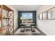 Home office with patterned wallpaper, large window, modern desk and shelving at 418 Glade Ct., Loris, SC 29569
