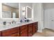 Bathroom featuring double sinks and custom cabinets at 4311 Grovecrest Circle, North Myrtle Beach, SC 29582