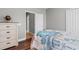 Bedroom featuring a dresser, closet, and bed with a stylish duvet, providing a tranquil resting place at 4311 Grovecrest Circle, North Myrtle Beach, SC 29582