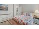 Comfortable bedroom with coastal themed decor, dresser, and a peek at the dining area through an open door at 4311 Grovecrest Circle, North Myrtle Beach, SC 29582