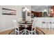 Cozy breakfast nook with a round table and four chairs, adjacent to the kitchen area at 4311 Grovecrest Circle, North Myrtle Beach, SC 29582
