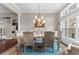 Formal dining room with elegant chandelier and detailed trim work at 4311 Grovecrest Circle, North Myrtle Beach, SC 29582