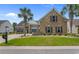 Charming brick home with a well-manicured lawn and palm trees, perfect for southern living at 4311 Grovecrest Circle, North Myrtle Beach, SC 29582
