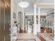 Inviting foyer with hardwood floors, decorative columns, and an open view to the living room at 4311 Grovecrest Circle, North Myrtle Beach, SC 29582
