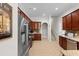 Bright kitchen with stainless steel refrigerator and wood cabinetry, offering ample storage and space at 4311 Grovecrest Circle, North Myrtle Beach, SC 29582