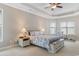 Comfortable main bedroom with tray ceilings, carpeted floor, and two windows at 4311 Grovecrest Circle, North Myrtle Beach, SC 29582