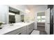 Bathroom with double sinks, quartz countertops, and tile floors at 435 Clear Lake Dr., Conway, SC 29526