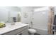 Bathroom with a single sink, white quartz countertops, and a shower-tub combo at 435 Clear Lake Dr., Conway, SC 29526