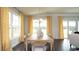 Well-lit dining room featuring a large table and charming yellow curtains at 435 Clear Lake Dr., Conway, SC 29526