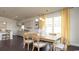 Bright dining area with modern table, stylish curtains, and view of kitchen at 435 Clear Lake Dr., Conway, SC 29526