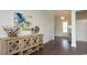 Inviting entryway with hardwood floors, decorative cotton stem and view of the front door at 435 Clear Lake Dr., Conway, SC 29526