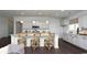 Bright open kitchen with hardwood floors, white cabinets, stainless appliances, and island at 435 Clear Lake Dr., Conway, SC 29526