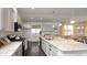 Modern open concept kitchen featuring white cabinets, stainless steel appliances, and tile backsplash at 435 Clear Lake Dr., Conway, SC 29526