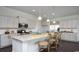 Bright kitchen with white cabinets, stainless steel appliances and island seating at 435 Clear Lake Dr., Conway, SC 29526