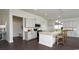Bright kitchen with island, stainless steel appliances, white cabinets, and bar stool seating at 435 Clear Lake Dr., Conway, SC 29526