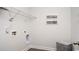 Bright laundry room with practical wire shelving and cute framed Laundry themed artwork at 435 Clear Lake Dr., Conway, SC 29526