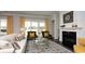Cozy living room features a fireplace, plush seating, and sliding glass doors to the outdoors at 435 Clear Lake Dr., Conway, SC 29526