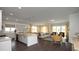 Open concept living and kitchen area featuring hardwood floors and bright natural lighting at 435 Clear Lake Dr., Conway, SC 29526