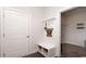 Charming mudroom with built-in bench and decorative wall decor leading to laundry room at 435 Clear Lake Dr., Conway, SC 29526