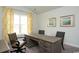 Home office with a rustic wood desk, three chairs, and yellow patterned curtains at 435 Clear Lake Dr., Conway, SC 29526