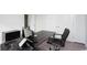 Comfortable home office setup with dark wood desk, ergonomic chair, and modern computer equipment at 435 Clear Lake Dr., Conway, SC 29526