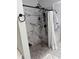 Bathroom features include a marble shower with a shower curtain and a dark colored shower head at 4425 Eastport Blvd. # I-1, Little River, SC 29566