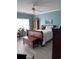 Bedroom boasts a blue wall, wood floors, an armoire, and a large bed with white comforter at 4425 Eastport Blvd. # I-1, Little River, SC 29566