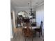 Elegant dining room featuring wood table, decorative mirror, and stylish chandelier at 4425 Eastport Blvd. # I-1, Little River, SC 29566
