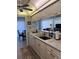 Kitchen with modern appliances, light cabinetry, and a pass-through to the dining area at 4425 Eastport Blvd. # I-1, Little River, SC 29566