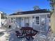 Poolside building with restrooms, pool rules posted, and a picnic table beside rows of pool chairs at 4425 Eastport Blvd. # I-1, Little River, SC 29566