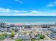 Aerial view showcasing a beach with a row of buildings at 4516 Seaview St. # 135, North Myrtle Beach, SC 29582