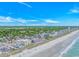 Aerial view capturing a coastal scene with buildings, beach and blue ocean at 4516 Seaview St. # 135, North Myrtle Beach, SC 29582
