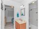 Bright bathroom featuring a vanity, mirror, and a shower-tub combination, providing all essential amenities at 4516 Seaview St. # 135, North Myrtle Beach, SC 29582