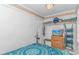 Bright bedroom with storage shelves, bed and flatscreen TV at 4516 Seaview St. # 135, North Myrtle Beach, SC 29582