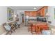 The kitchen has granite countertops and barstool seating, next to dining and living area at 4516 Seaview St. # 135, North Myrtle Beach, SC 29582