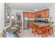 The kitchen has granite countertops and barstool seating, next to dining and living area at 4516 Seaview St. # 135, North Myrtle Beach, SC 29582