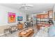 Inviting living room with a couch, dinette, TV, and open kitchen with island and barstool seating at 4516 Seaview St. # 135, North Myrtle Beach, SC 29582