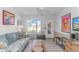 Bright living room featuring a couch, seating, and a large window with a view of the outdoors at 4516 Seaview St. # 135, North Myrtle Beach, SC 29582