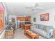 Inviting living room with a couch, dinette, TV, and open kitchen with island and barstool seating at 4516 Seaview St. # 135, North Myrtle Beach, SC 29582