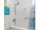 Clean bathroom shower with showerhead and blue curtains at 4516 Seaview St. # 135, North Myrtle Beach, SC 29582