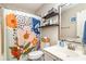 Well-lit bathroom featuring a decorative shower curtain, sink, and shelving for storage at 4616 Lomax Ct. # 9-B, Murrells Inlet, SC 29576