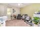 Spacious bedroom with large window, comfortable seating, and a baby changing station at 4616 Lomax Ct. # 9-B, Murrells Inlet, SC 29576