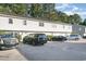 Townhouse exterior showing the front facade with ample parking and landscaping at 4616 Lomax Ct. # 9-B, Murrells Inlet, SC 29576