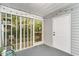Charming patio with string lights and view of the surrounding greenery at 4616 Lomax Ct. # 9-B, Murrells Inlet, SC 29576
