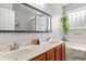 Bathroom with double sink vanity, modern fixtures, large mirror, and a separate soaking tub at 4697 Farm Lake Dr., Myrtle Beach, SC 29579