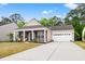 Charming home featuring a well-manicured lawn, brick accents, and a two car garage at 4697 Farm Lake Dr., Myrtle Beach, SC 29579