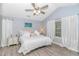 Inviting bedroom with vaulted ceiling, ceiling fan, neutral color palette, and bright window views at 5 Old Barge Dr., Pawleys Island, SC 29585