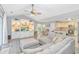 Expansive living space with built-in shelving and media center flows into the kitchen and breakfast nook at 5 Old Barge Dr., Pawleys Island, SC 29585