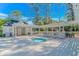 Community hot tub surrounded by lounge chairs under a pergola, and a nearby changing area with showers at 5 Old Barge Dr., Pawleys Island, SC 29585