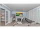 Comfortable living room with a large sectional sofa, fireplace, and entertainment center at 5 Old Barge Dr., Pawleys Island, SC 29585